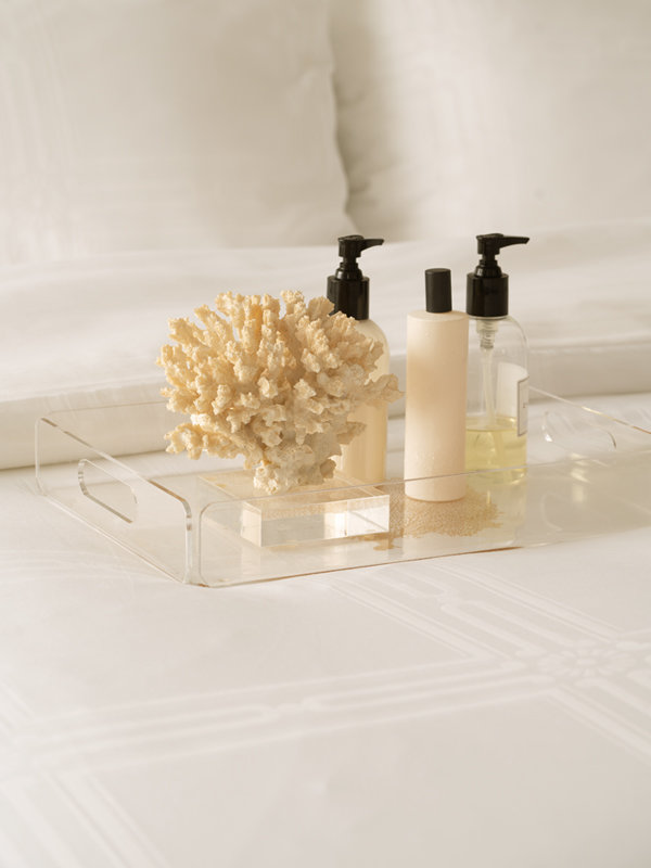 Skincare set on top of Marialma's Ivory Cosmetic Algae Duvet Cover with Jacquard Pattern